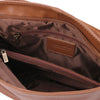 Internal Zip Pocket View Of The Cinnamon Tassel Crossbody Bag