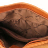 Internal Features View Of The Cognac Tassel Crossbody Bag
