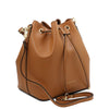 Angled And Shoulder Strap View Of The Cognac Leather Bucket Bag