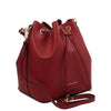 Angled And Shoulder Strap View Of The Red Leather Bucket Bag