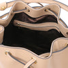 Internal Zip Pocket View Of The Champagne Leather Bucket Bag