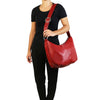 Woman Posing With The Red Hobo Shoulder Bag